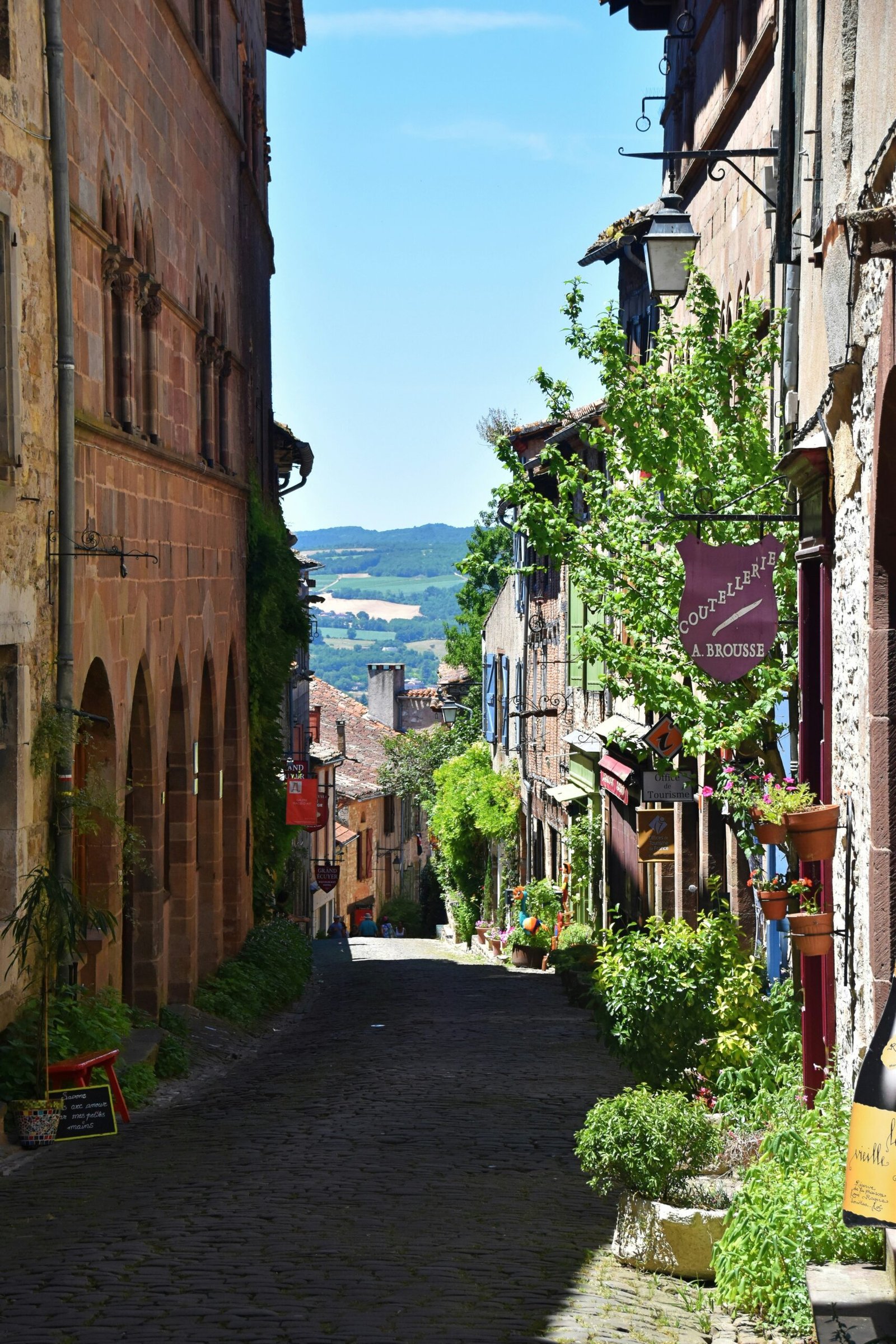 Quiet cobbled street in Cordes-sur-Ciel, Southern France, offering a charming village setting for a France yoga retreat.