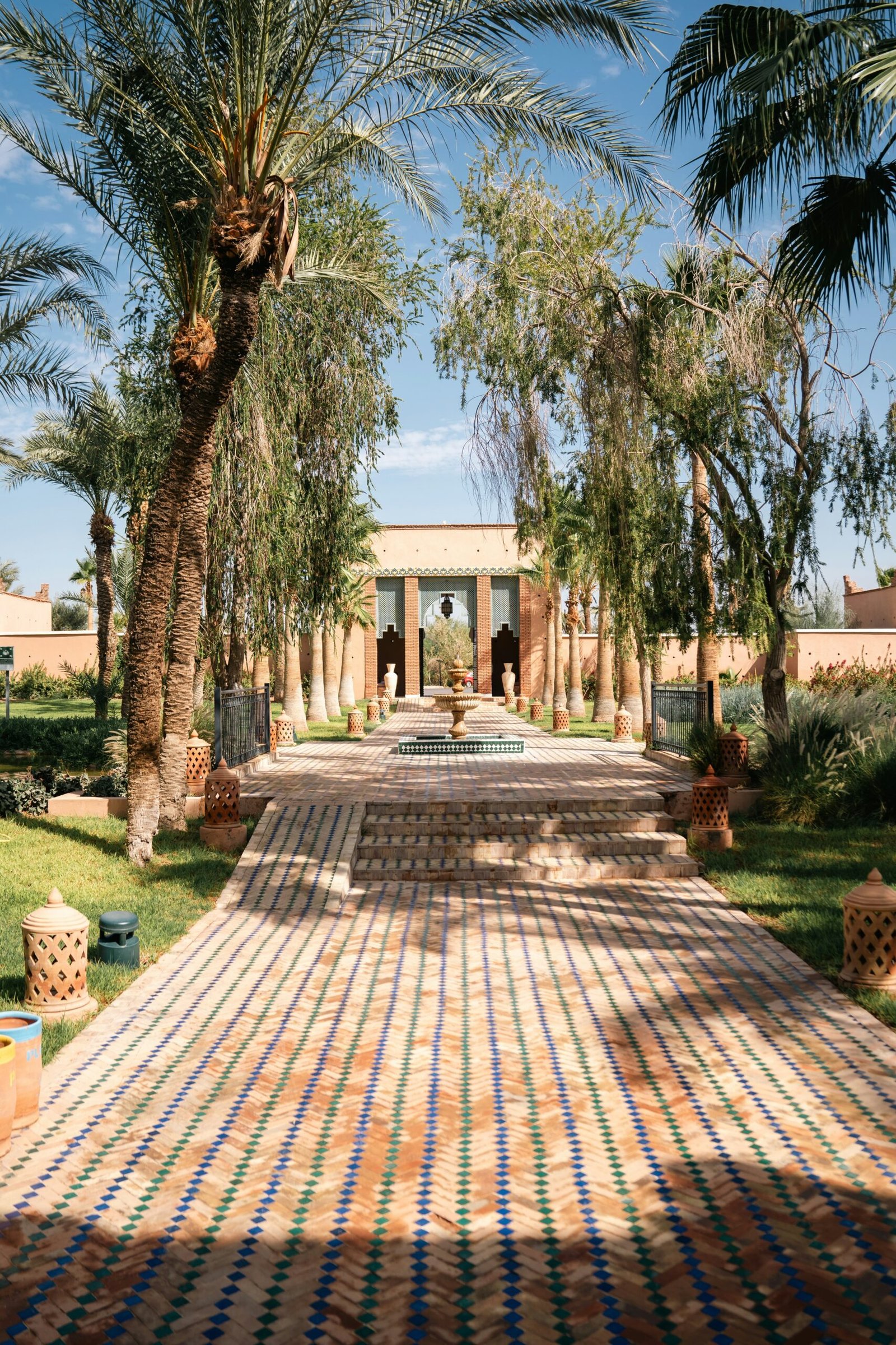 marrakesh garden with fountain and palms at the start of spring in morocco