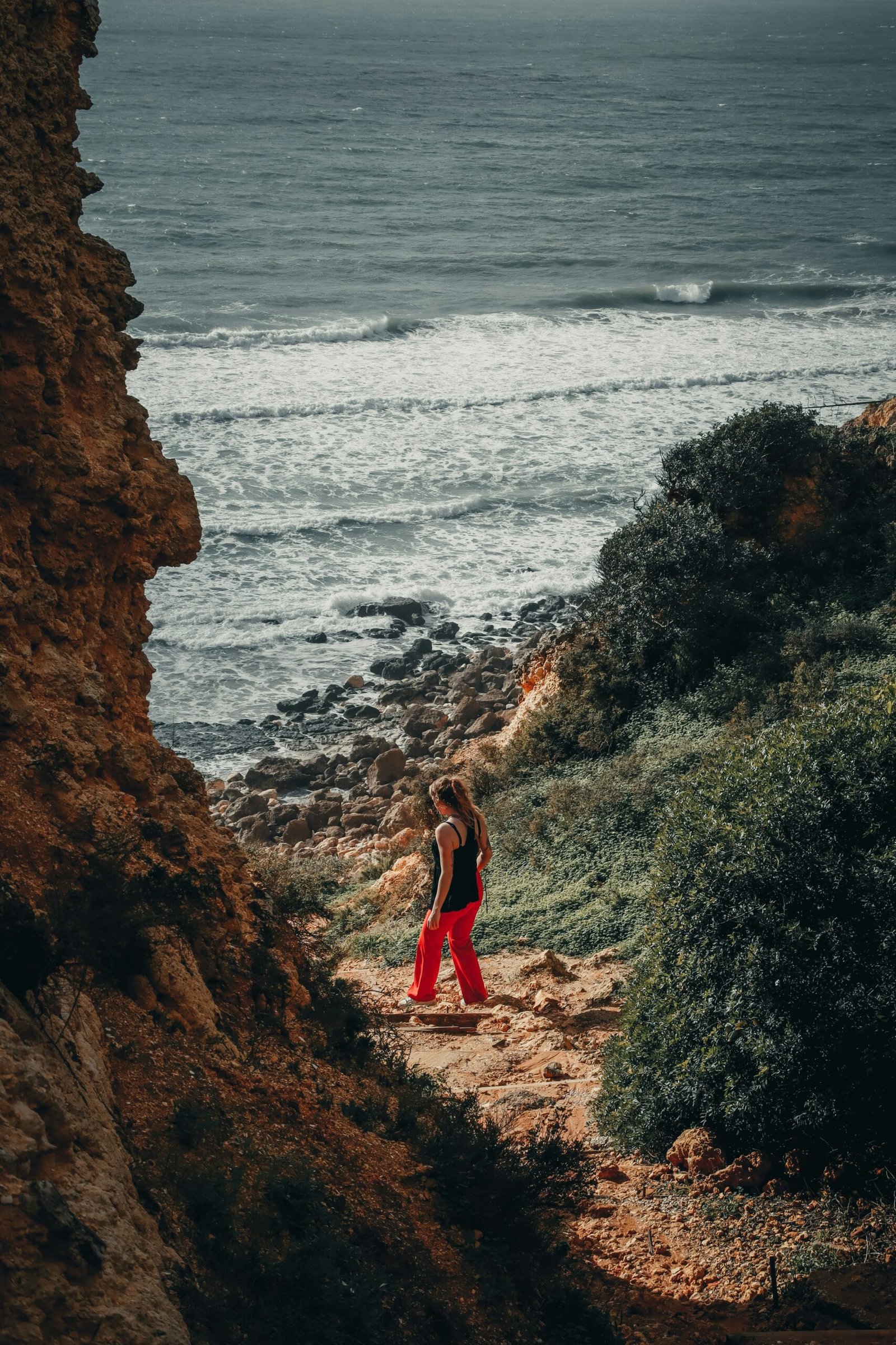 woman practicing yoga by the sea during a february retreat in portugal