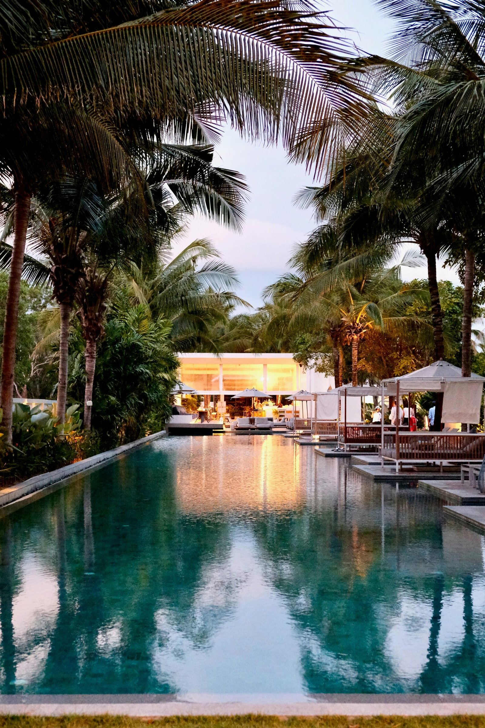 Tropical resort pool in Phuket, Thailand suited to a luxury Ayurveda glow retreat with rest, pampering, and Pitta-soothing care.