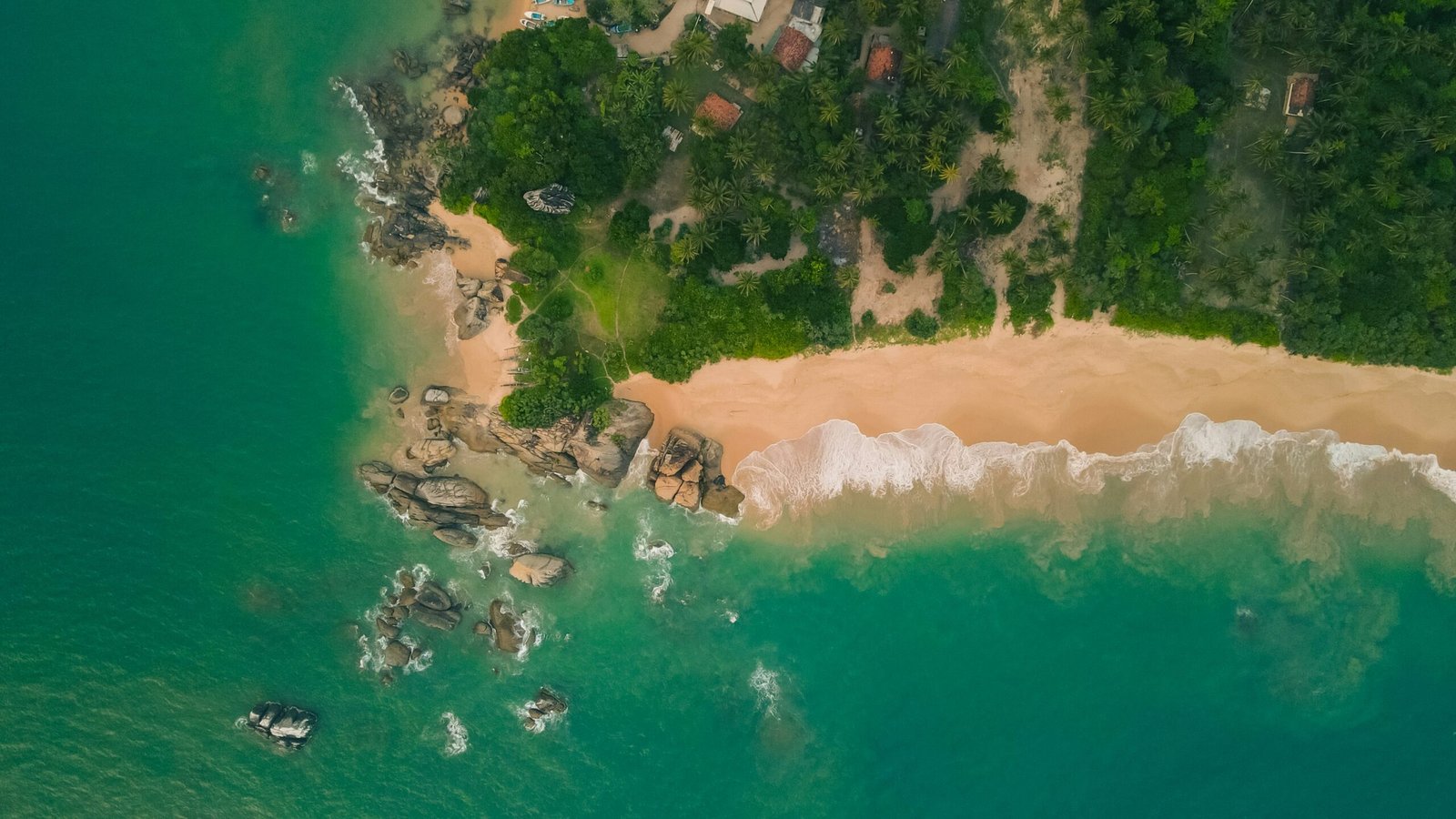 Aerial coastline view in Balapitiya with sea and greenery creating a calm setting for an ayurveda retreat in Sri Lanka.