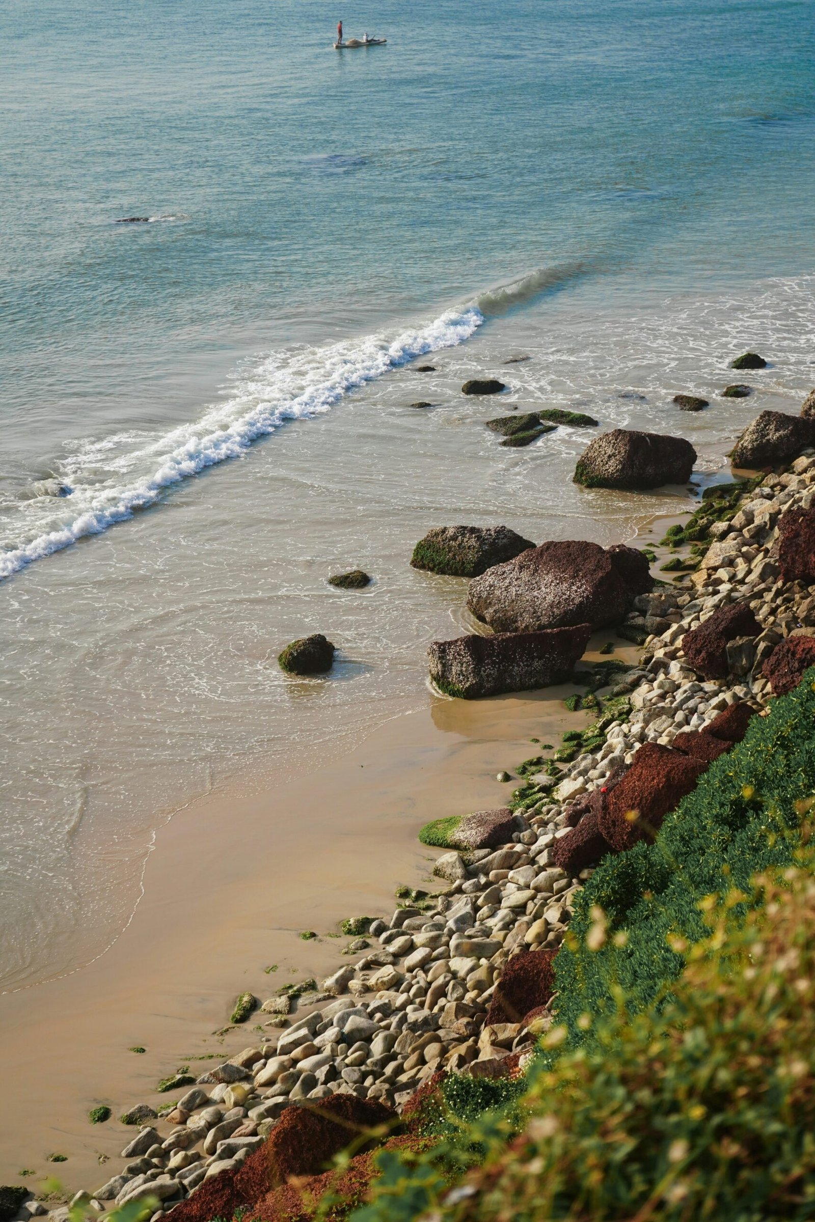 Coastal cliffs and shoreline in Varkala, Kerala, matching the calm seaside mood of an Ayurvedic retreat destination