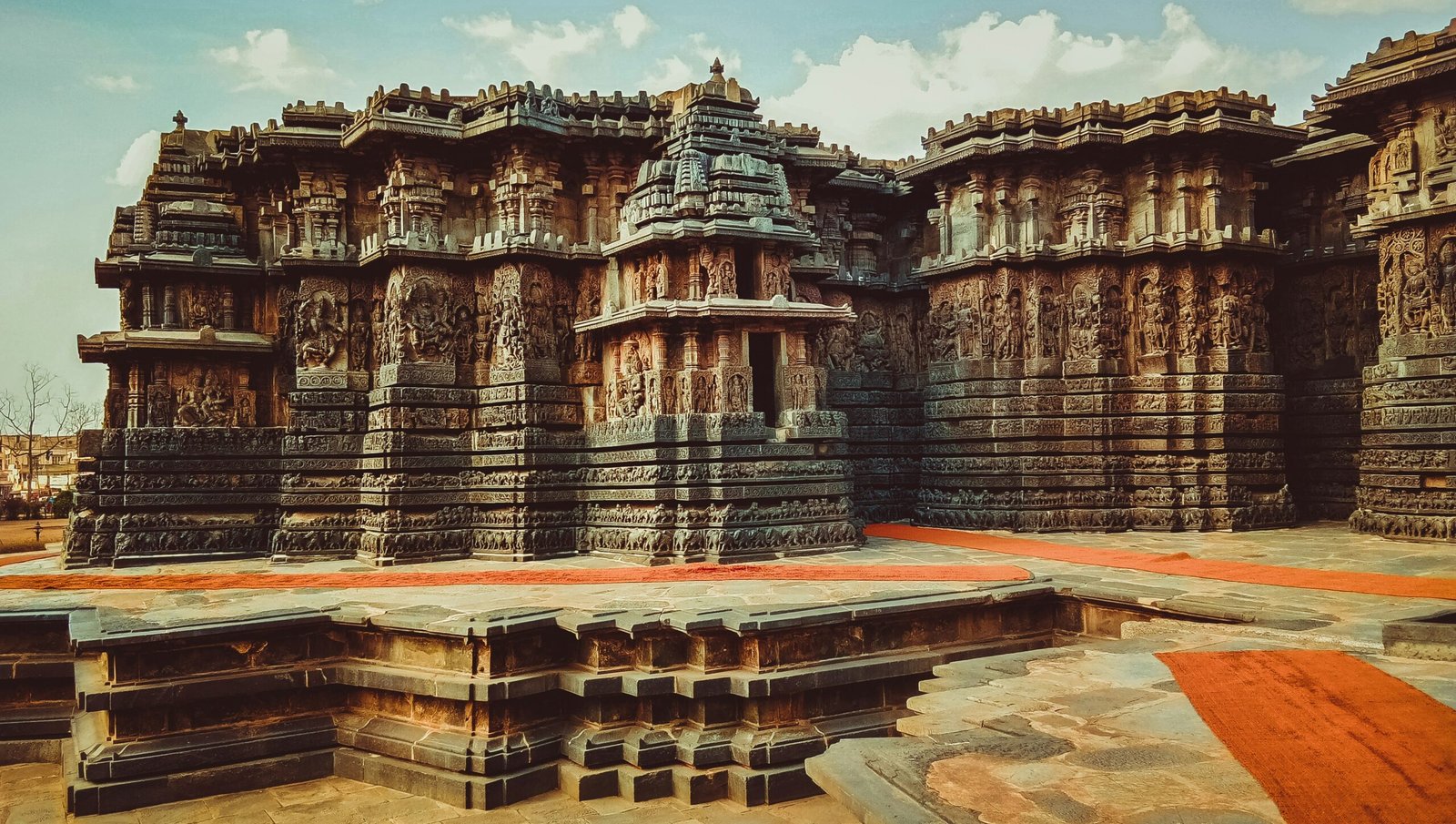 Ancient temple stonework in Beluru, Karnataka, evoking the heritage, discipline, and sacred atmosphere of a retreat journey in India.