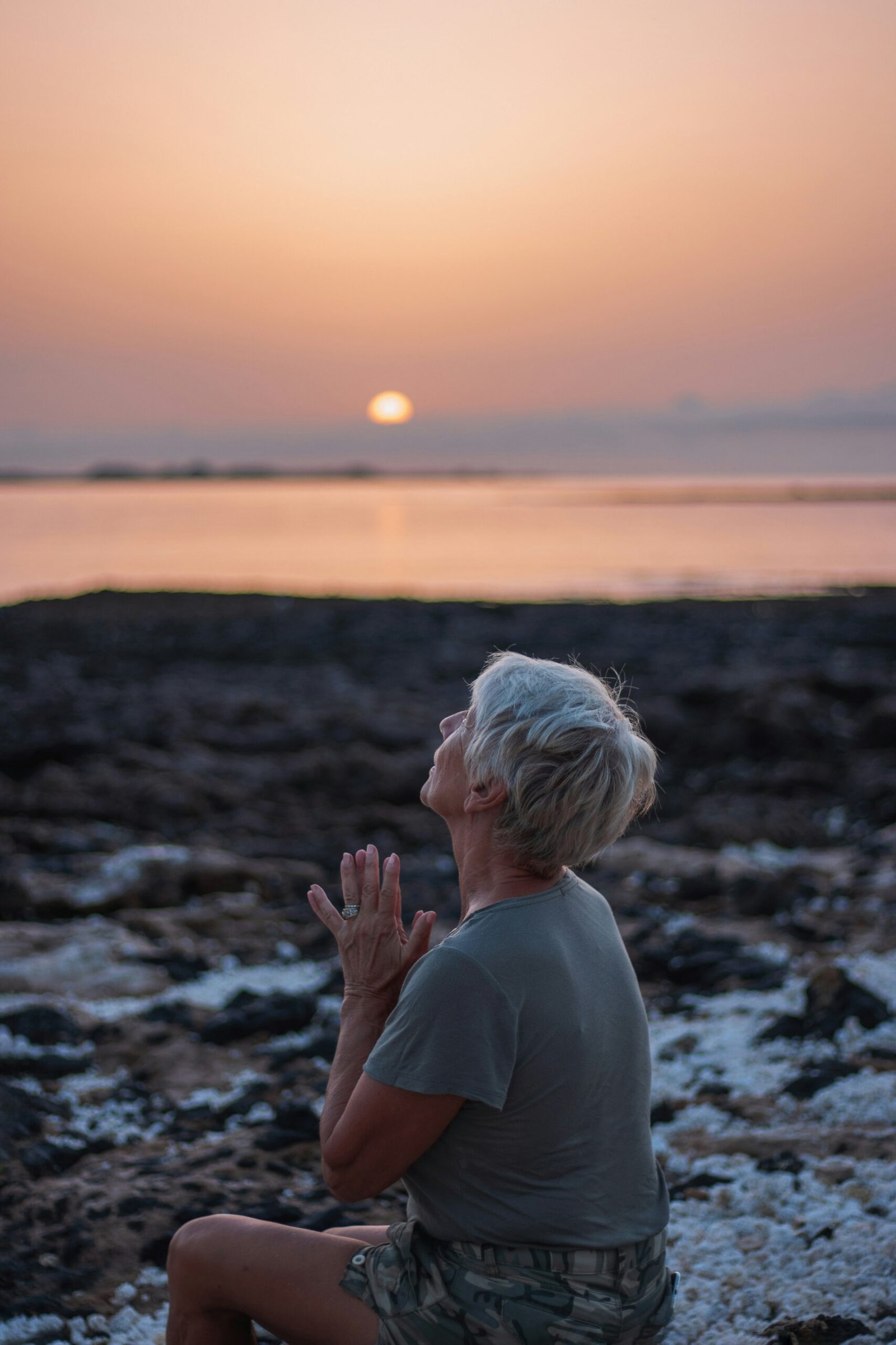 person practicing yoga at sunrise in palma spain