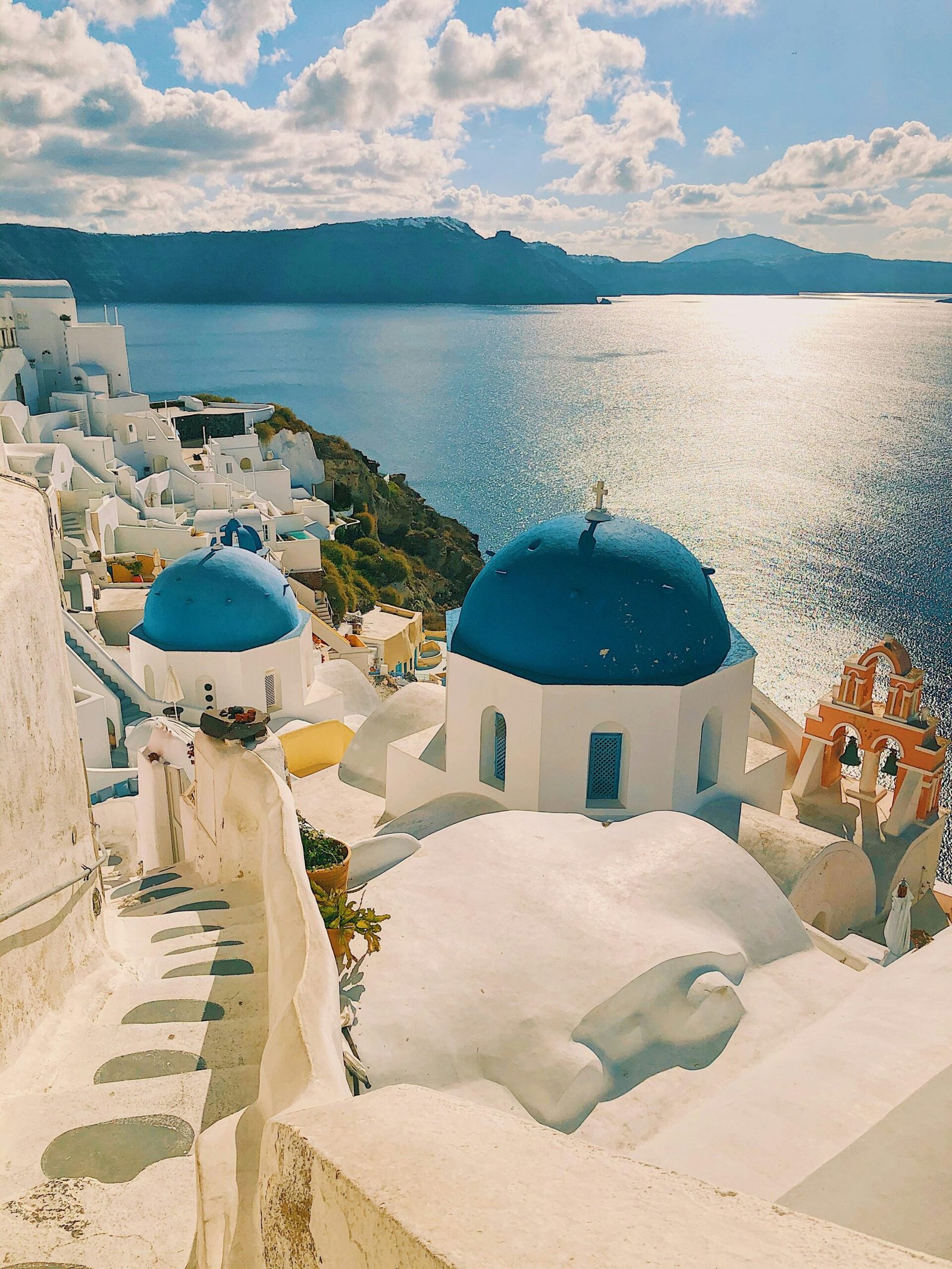 Whitewashed seaside retreat buildings overlooking the water in Santorini, Greece