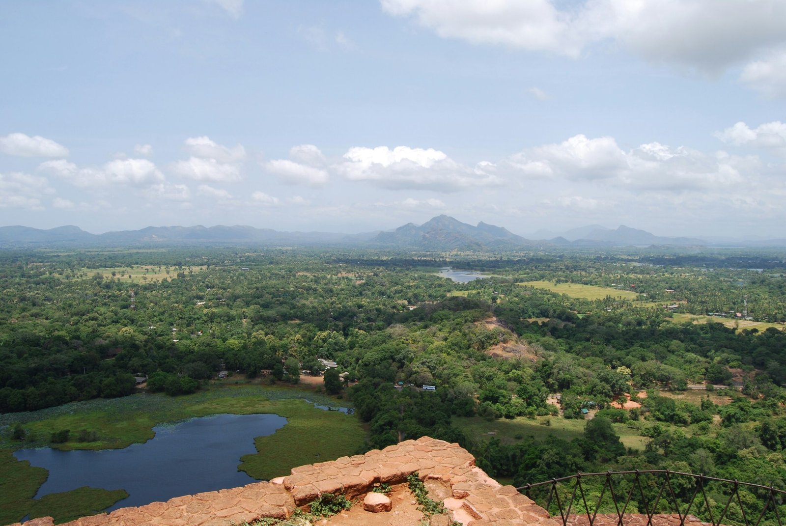 Aerial view of Sri Lanka’s green landscape capturing the spacious, renewing feel of a seasonal wellness journey.