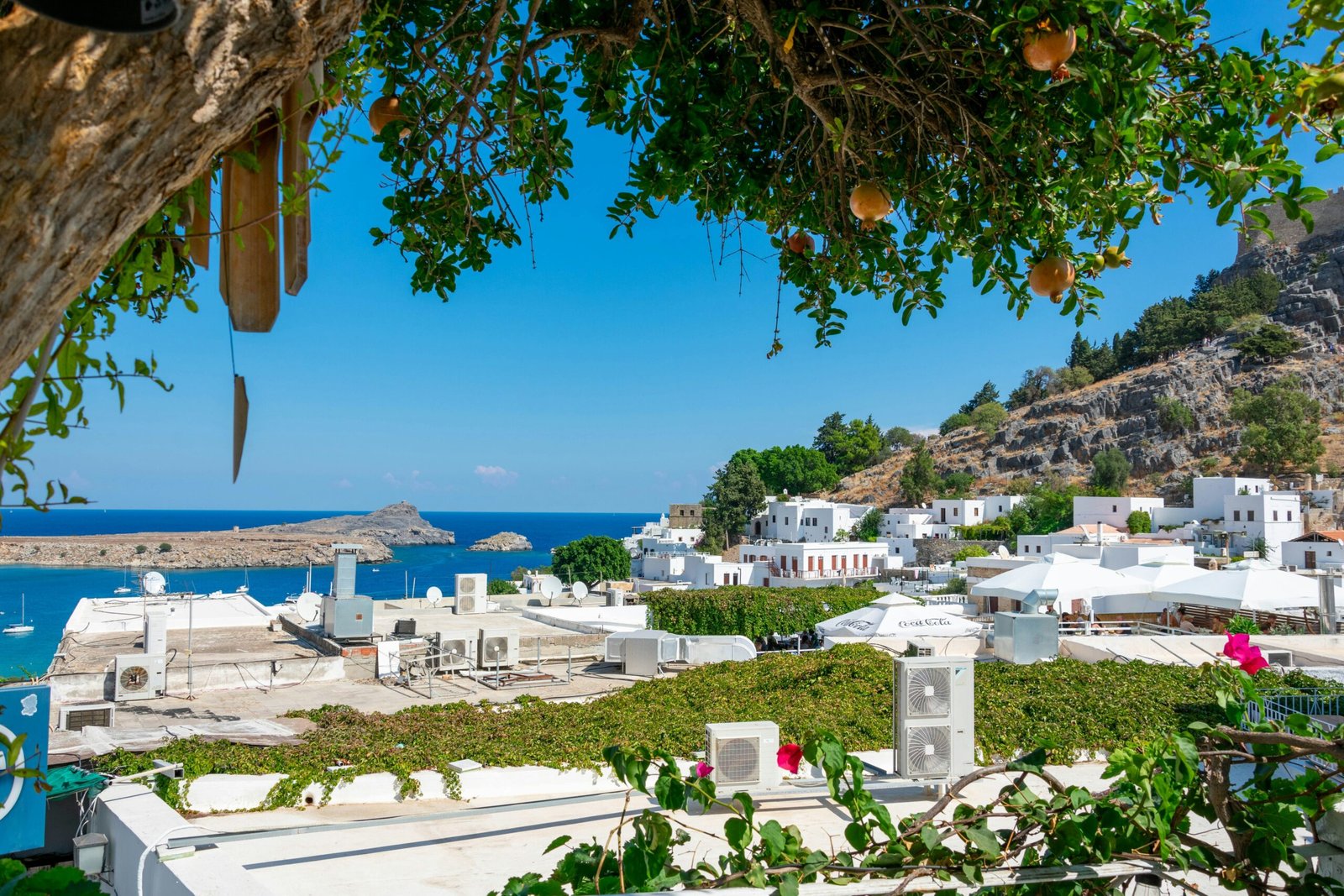 White hillside homes in Lindos, Rhodes, reflecting the quiet island atmosphere of a February retreat.