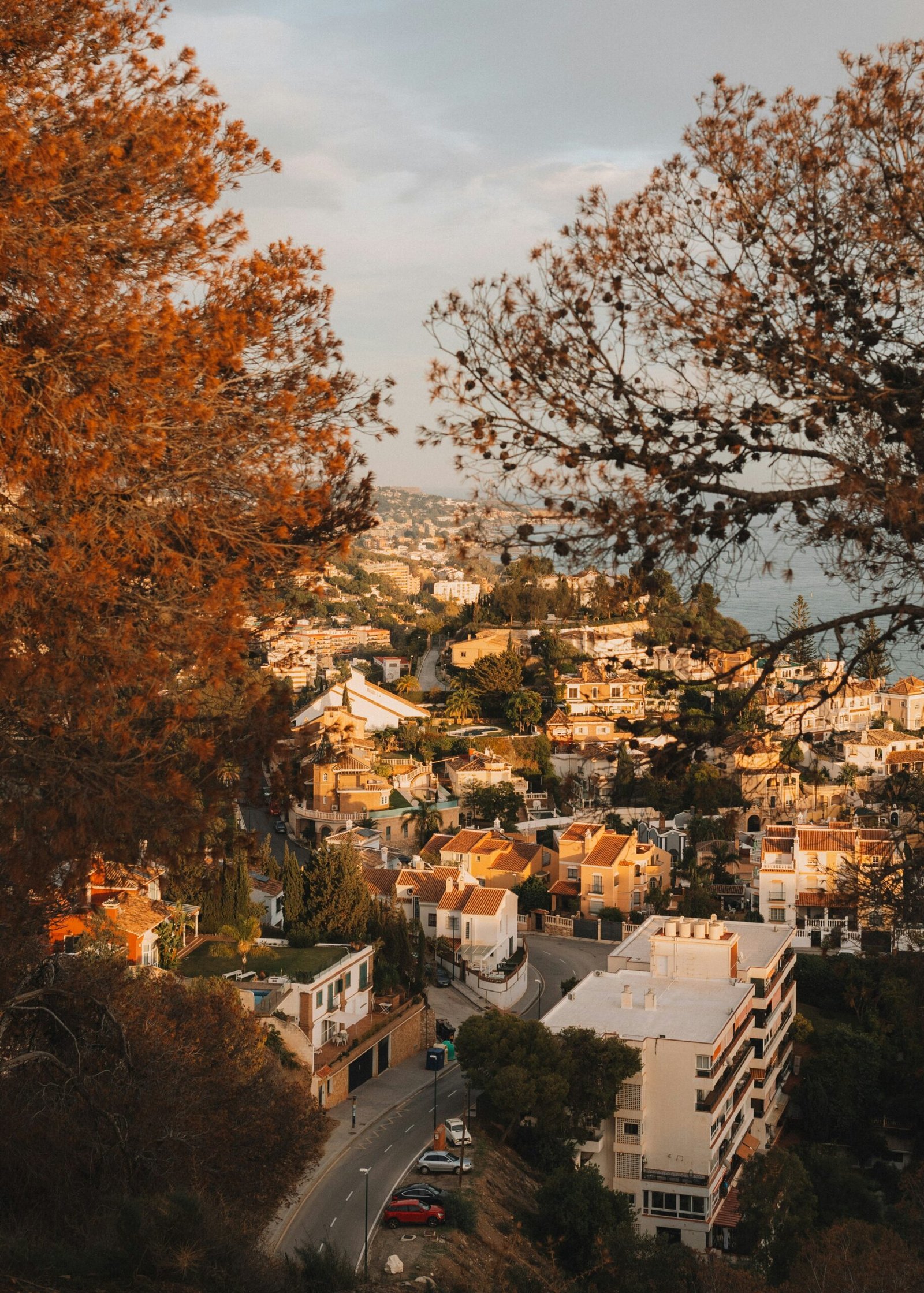 Hilltop view over Granada, Spain, with the city spreading below and mountains in the distance.