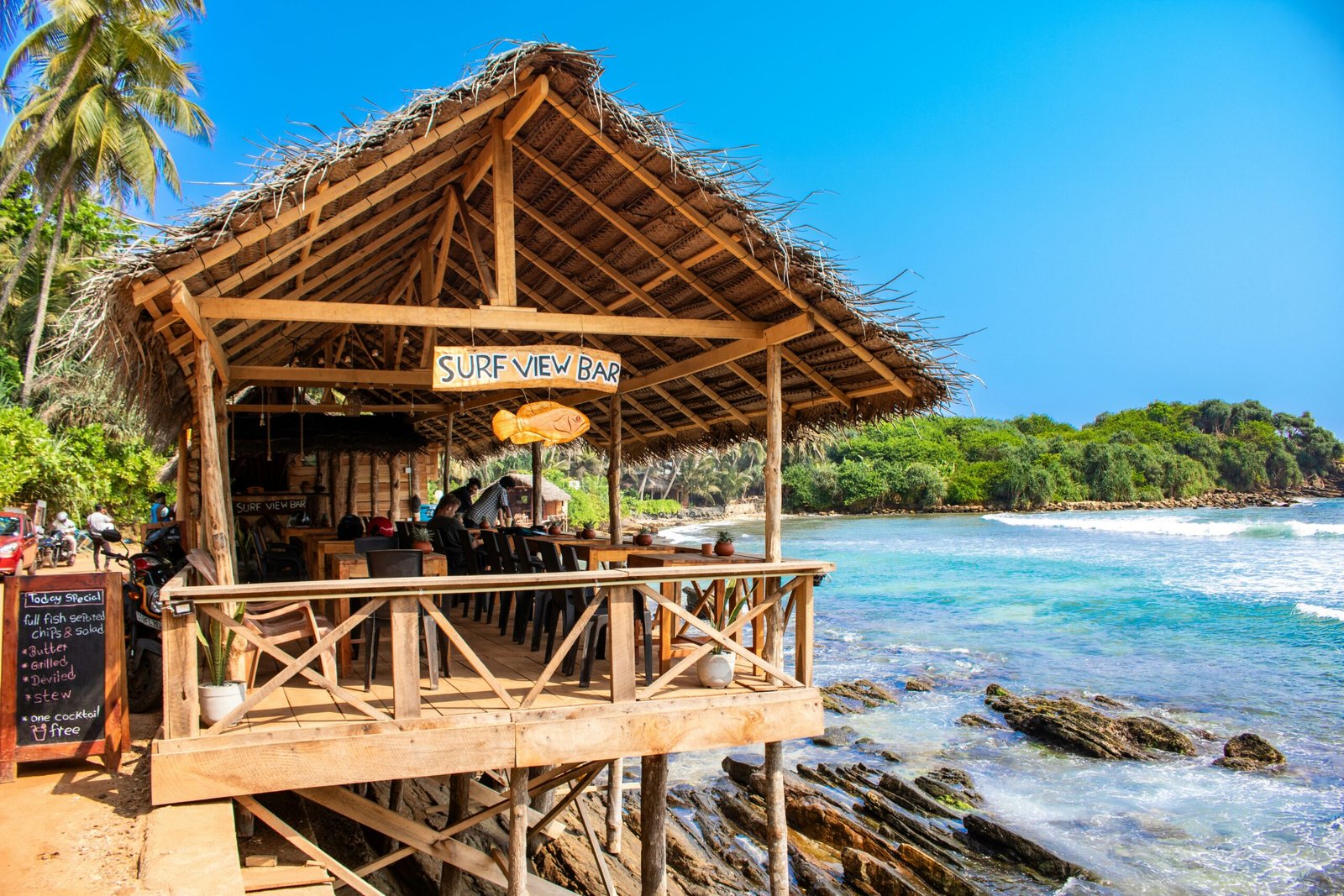 Beachfront dining space with open sea views for a relaxing retreat focused on nourishment and coastal calm
