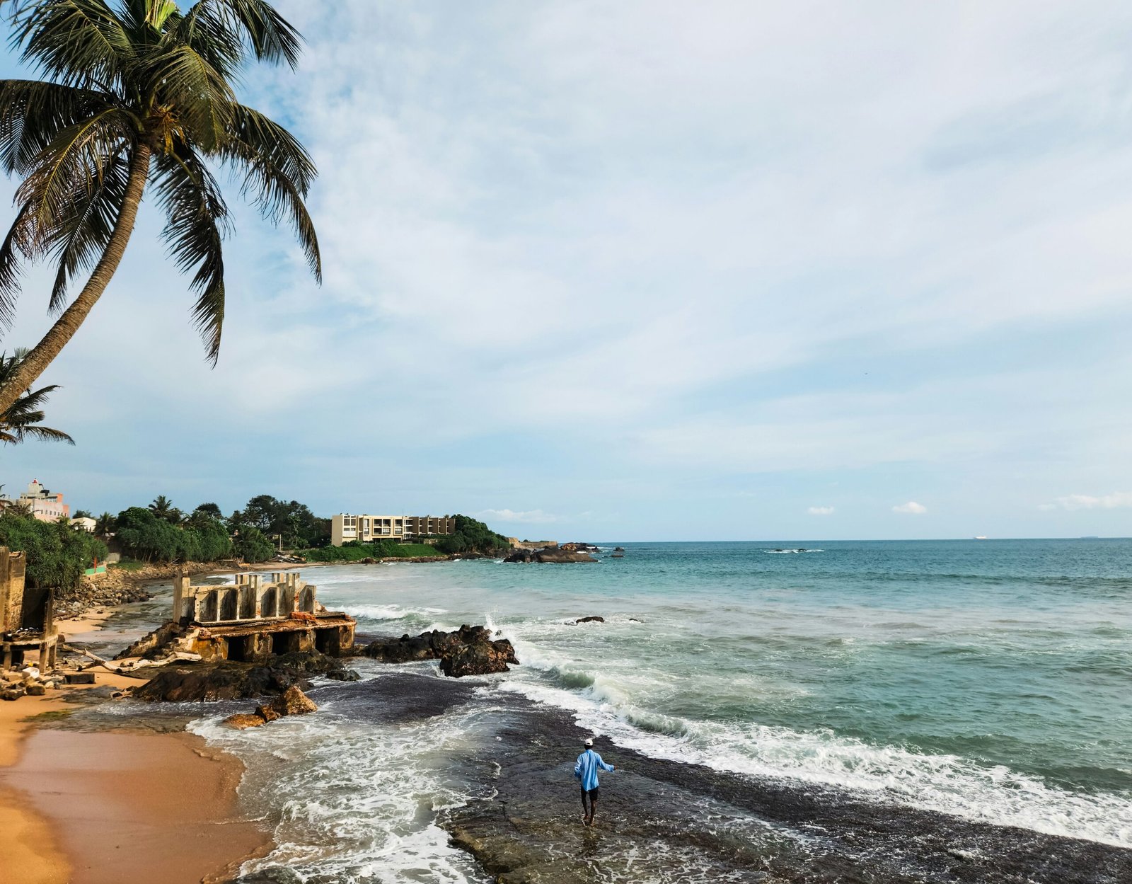 Palm-fringed ocean view from Galle, Sri Lanka, creating a serene coastal backdrop for an ayurveda retreat focused on rest and renewal.
